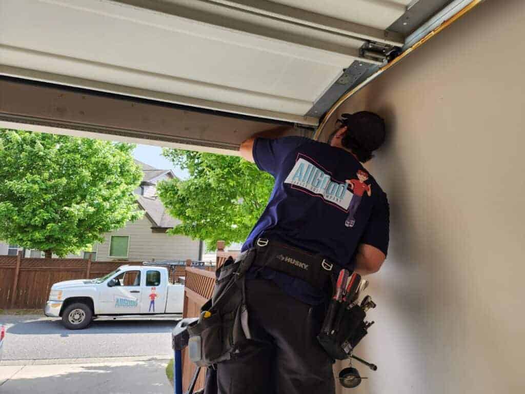 garage door cable repair being performed in Atlanta GA